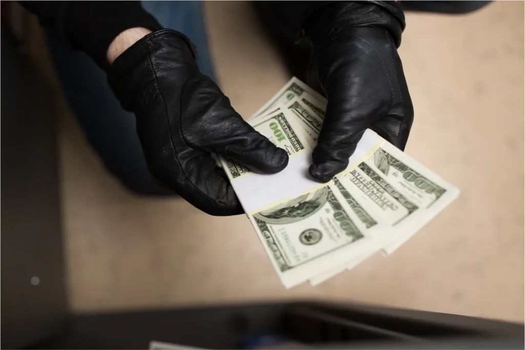 counting-money-with-black-gloves