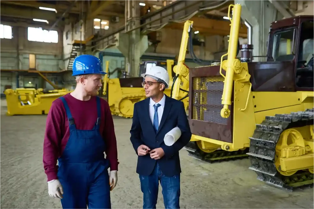 engineer-discussing-with-client-in-a-machinery-factory