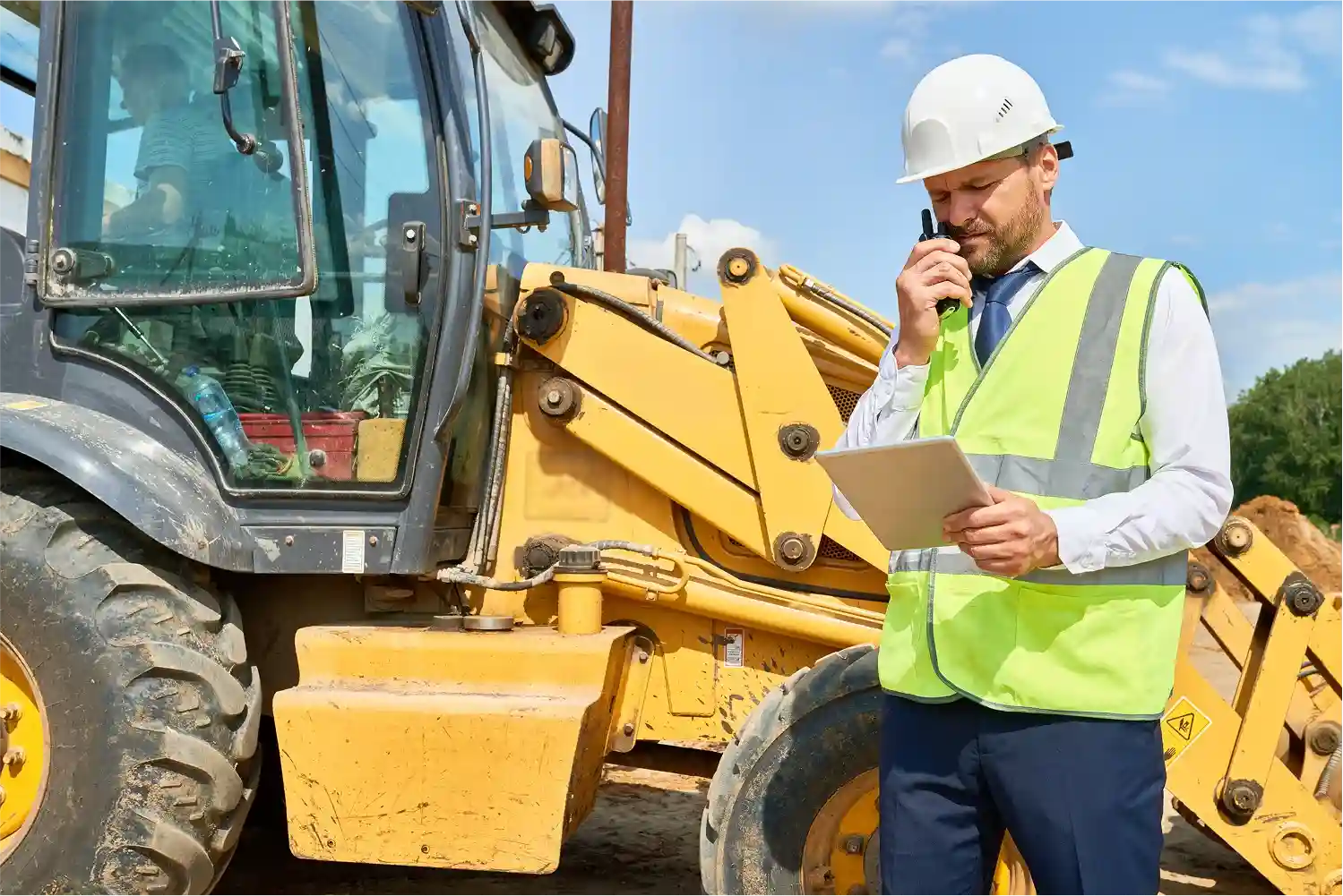 engineer-talking-through-phn-near-jcb