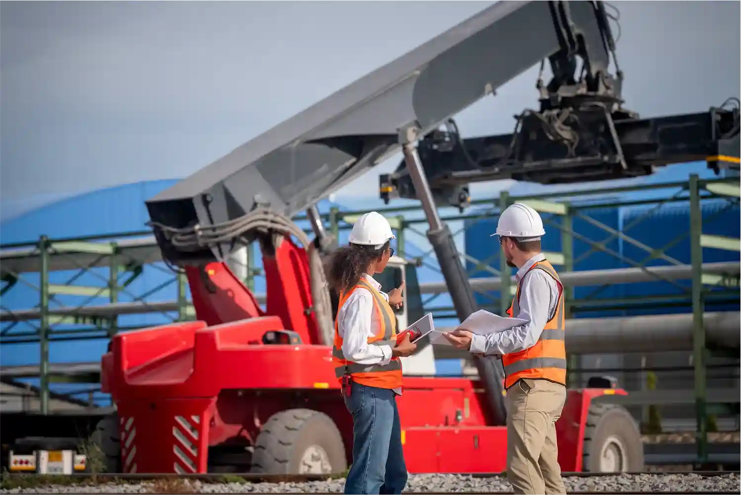 engineers-talking-by-looking-to-a-red-truck