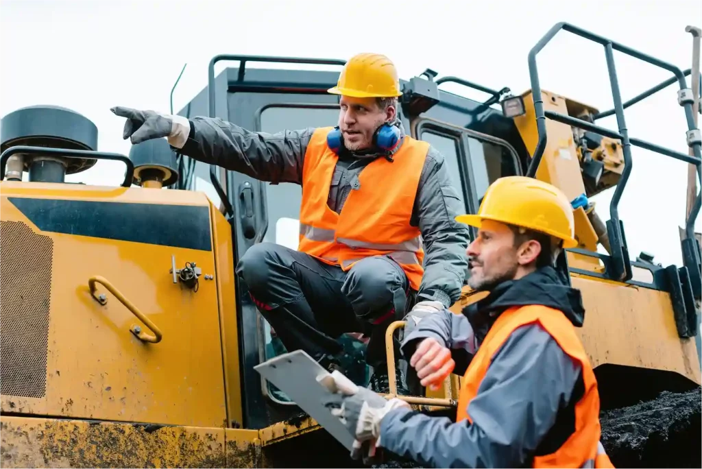engineers-talking-in-a-heavy-vehicle