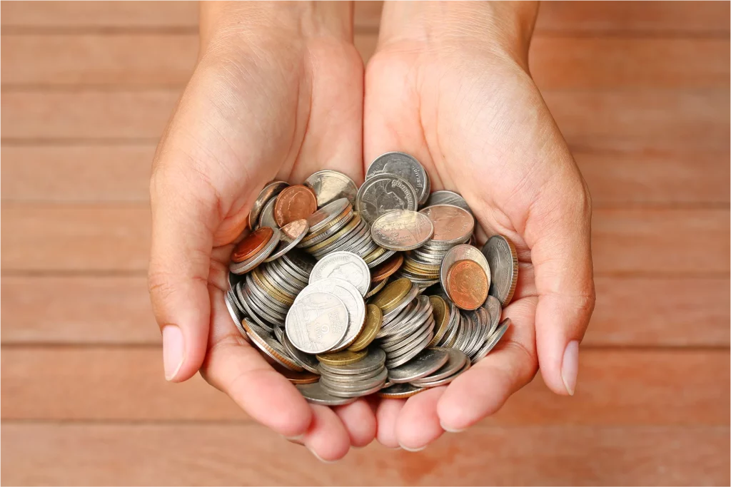 holding-coins-in-arms