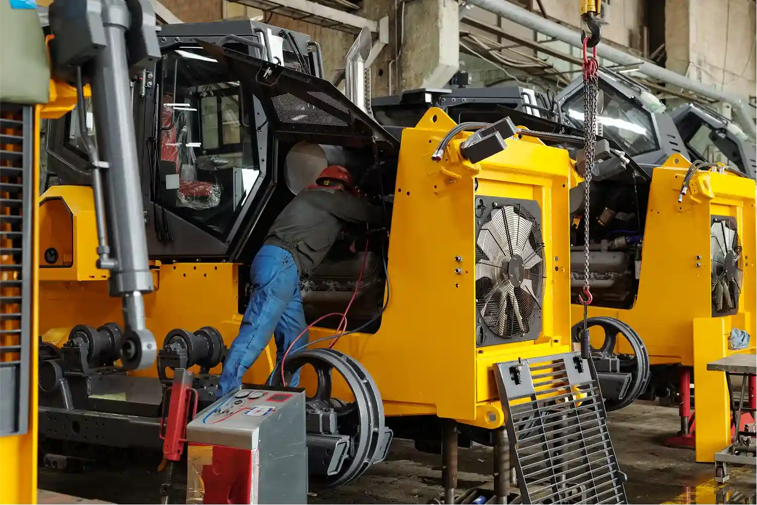 staff-checking-yellow-heavy-vehicles